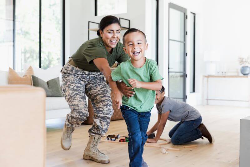 Female soldier chasing child on flooring image