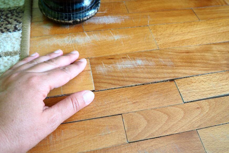 Scratched old parquet flooring needs maintenance